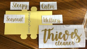 essential oil labels on a table.  Vinyl labels of Thieves cleaner, Sleepy, Seasonal, Wellness, and Calm